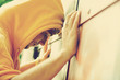 Photo: Young angry man on graffiti grunge wall Young angry man on graffiti grunge wall