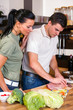 Couple preparing lunch in kitchen
