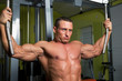 Muscle shaped man exercise on sport gym fitness club