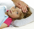 mother takes care of the sick little girl with fever