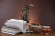 Law concept with wooden table and dark background