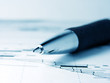 Pen on graph. Macro image.