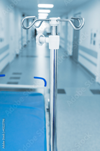 Photo: Long corridor in hospital with trolly and rack Long corridor in hospital with trolly and rack