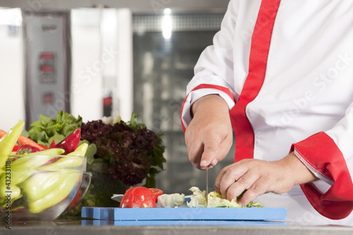 Photo: chef at work in a restaurant chef at work in a restaurant
