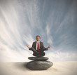 Business man relaxes on the stone