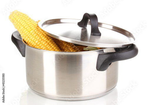Photo: Fresh corn cobs in pot isolated on white Fresh corn cobs in pot isolated on white