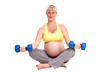 Foto: pregnant woman trains with dumbbells pregnant woman trains with dumbbells