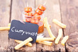 Foto: Currywurst mit Pommes Currywurst mit Pommes