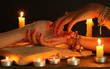 reading the lines hand in a woman's hands on black backcground