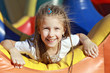 Foto: Happy girl on carousel Happy girl on carousel
