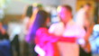 some pairs dancing in free style in club light