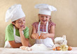 Foto: Kids preparing the dough for a cookie, pizza or pasta Kids preparing the dough for a cookie, pizza or pasta