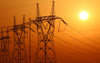 high voltage electrical tower during sunset