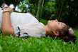 Thai University Student Sleep Happily On Grassland