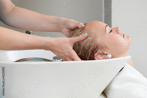 Photo: Woman Getting a Hair Wash Woman Getting a Hair Wash