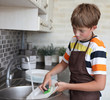 boy doing the dishes