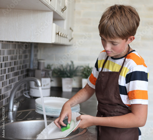Photo: boy doing the dishes boy doing the dishes