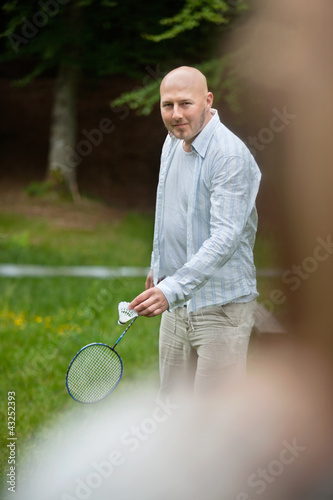 Photo: Man Playing Badminton In Park Man Playing Badminton In Park
