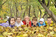 kids lying on leaves