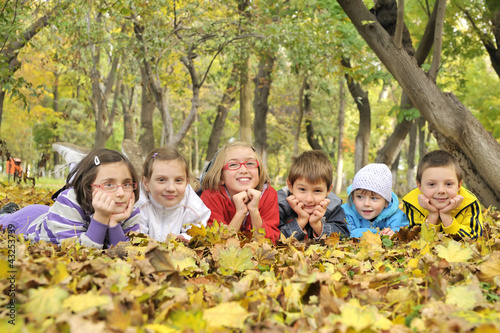 Photo: kids lying on leaves kids lying on leaves