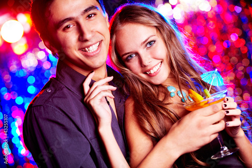 Photo: Couple of clubbers Couple of clubbers