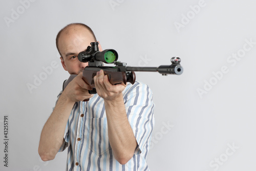 Photo: man with gun man with gun