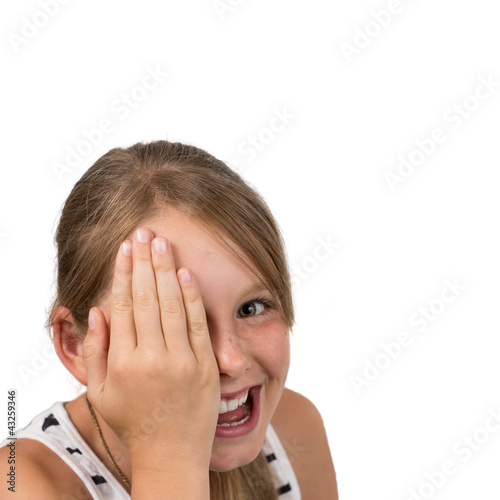 Photo: Funny blond Girl holding one Eye, isolated Funny blond Girl holding one Eye, isolated