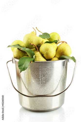 Photo: Juicy flavorful pears in pail isolated on white Juicy flavorful pears in pail isolated on white