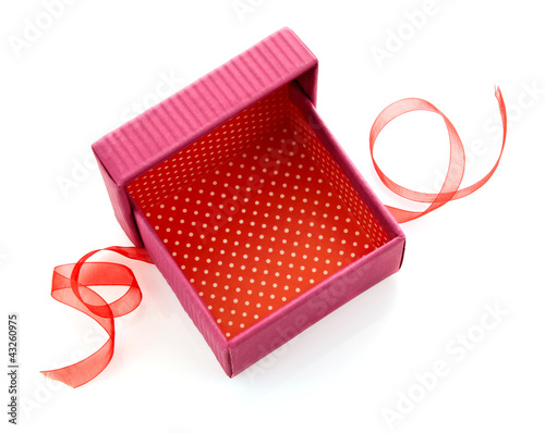 Photo: opened red gift box with ribbon isolated on white background opened red gift box with ribbon isolated on white background