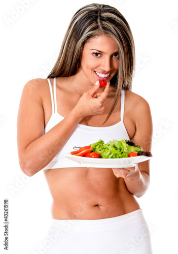 Photo: Woman eating a salad Woman eating a salad