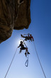 Climbing team struggles to the summit.
