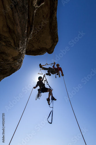 Photo: Climbing team struggles to the summit. Climbing team struggles to the summit.