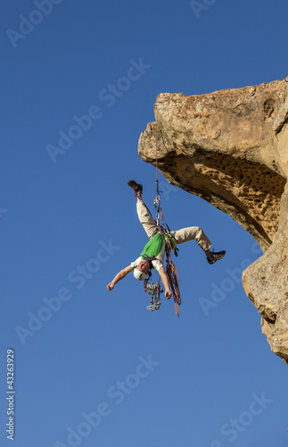 Photo: Climber rappelling from the summit. Climber rappelling from the summit.