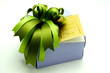 Gift Box with Colorful Ribbons on White Background