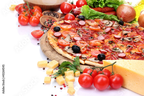 Photo: delicious pizza, vegetables and salami isolated on white. delicious pizza, vegetables and salami isolated on white.