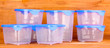 Plastic containers for food on wooden background