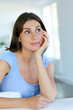 Closeup of brunette girl dreaming about something