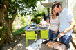 Photo: Family cooking meat on barbecue grill Family cooking meat on barbecue grill