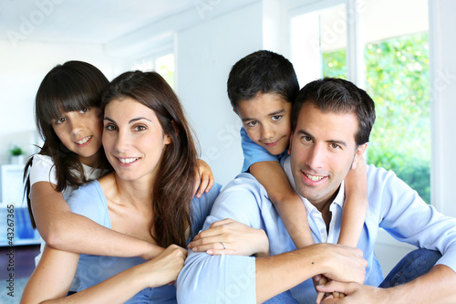 Photo: Family relaxing in sofa at home Family relaxing in sofa at home