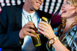 Foto: People with cocktails in bar or club People with cocktails in bar or club