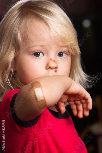 Photo: Injured boy with band aid on Injured boy with band aid on