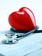 A heart with a stethoscope lying .