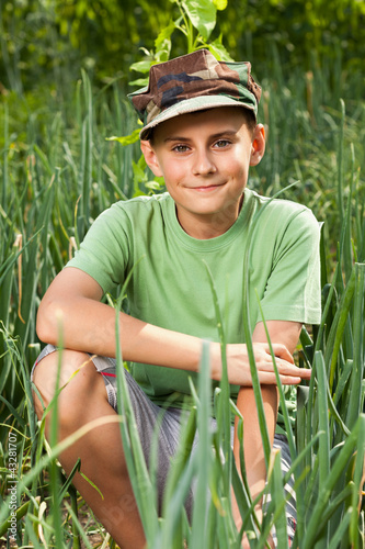 Photo: Boy in a lawn of onions Boy in a lawn of onions