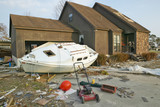 Photo: Boat and debris in front of house heavily hit by Hurricane Ivan in Pensacola Florida Boat and debris in front of house heavily hit by Hurricane Ivan in Pensacola Florida