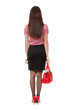 A slender girl with a satchel in the studio. View from the back