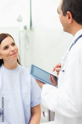 Photo: Woman listening to a doctor Woman listening to a doctor