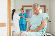 Patient in a wheelchair looking down