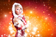 Foto: blonde Weihnachtsfrau pustet Schnee blonde Weihnachtsfrau pustet Schnee