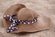 Foto: brown summer hat on the Sand brown summer hat on the Sand