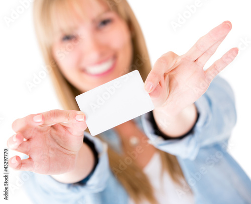 Foto: Woman holding a business card Woman holding a business card